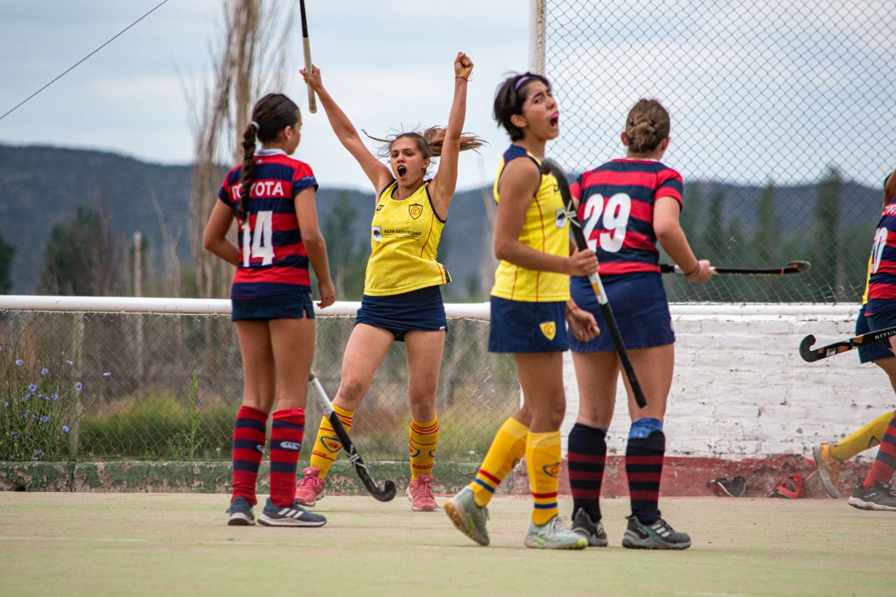 Mastering the First Impression: Your intriguing post title goes here Dynamic capture of women's field hockey team celebrating a goal outdoors, showcasing team spirit and excitement.